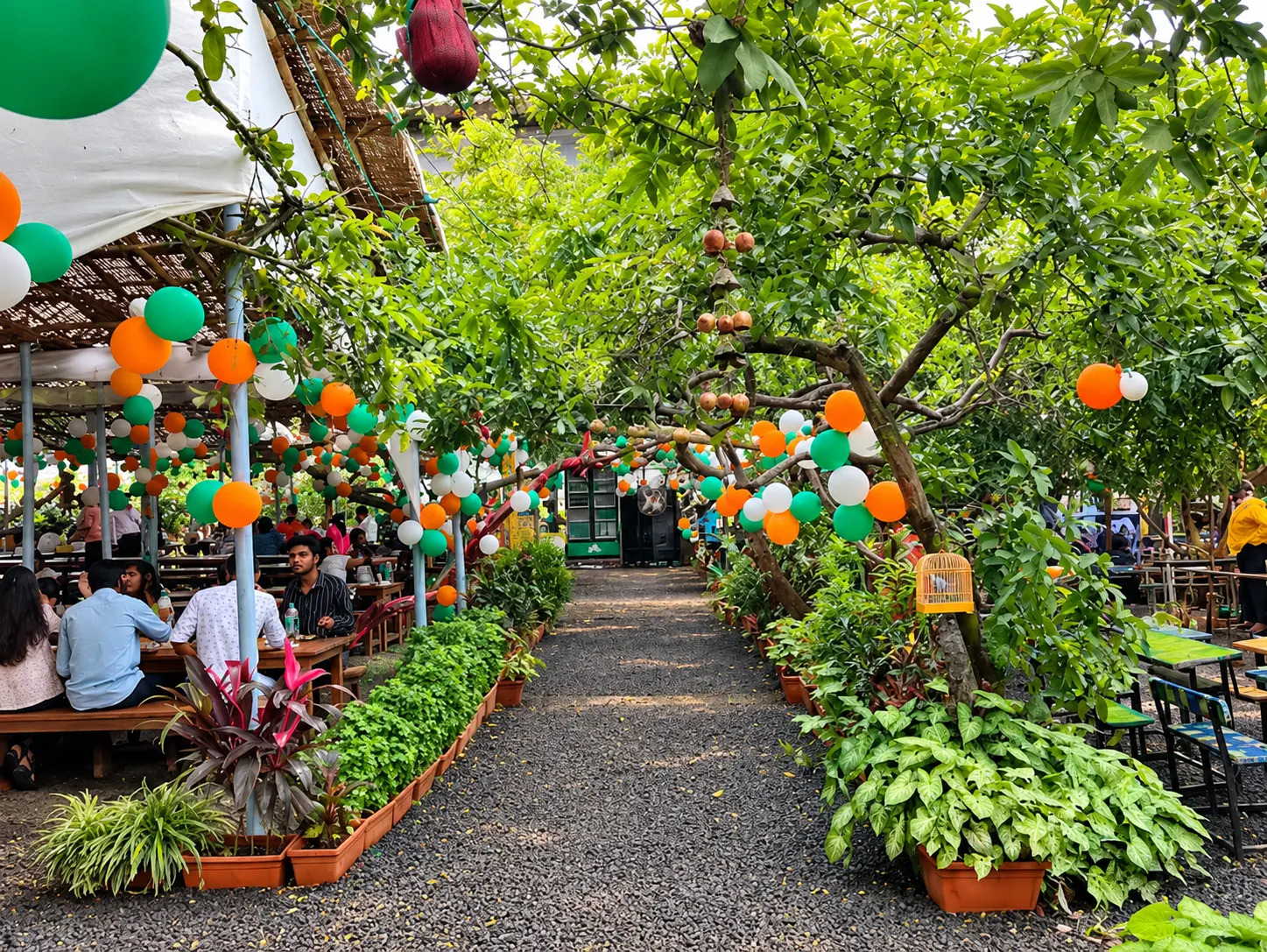 Festive balloons over the garden walkway and tables