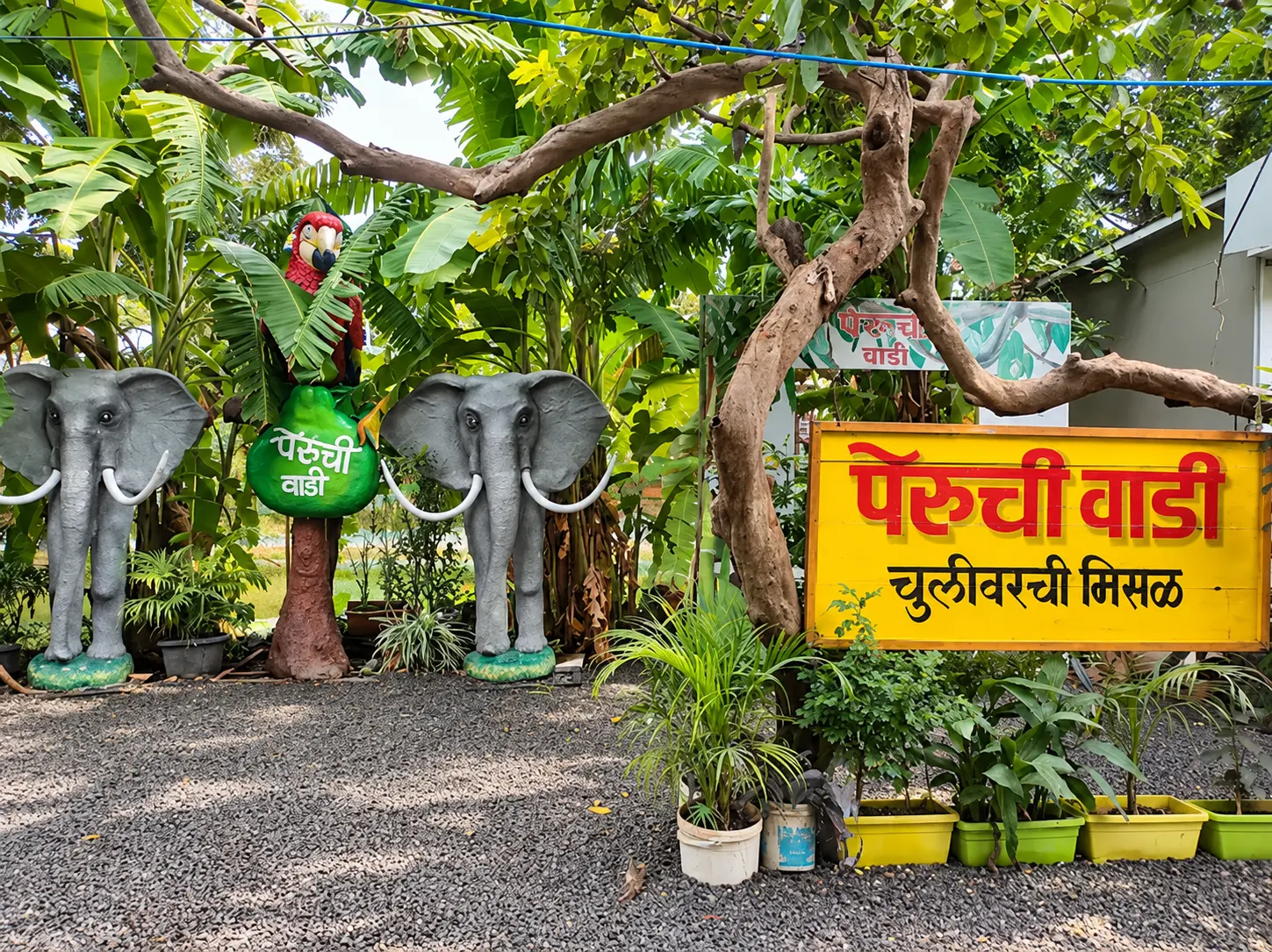 Garden sign for chulivarchi misal with elephant statues